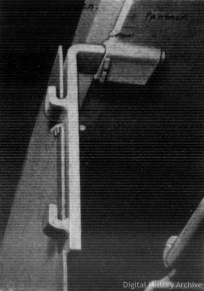 A downwards and oblique view of a cut-away model of the skirt mount.