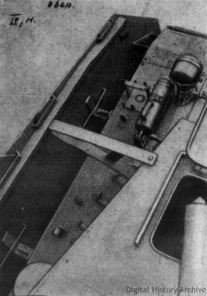 A downwards and oblique view of a part of the armor skirt. The brackets and hangers are clearly visible.